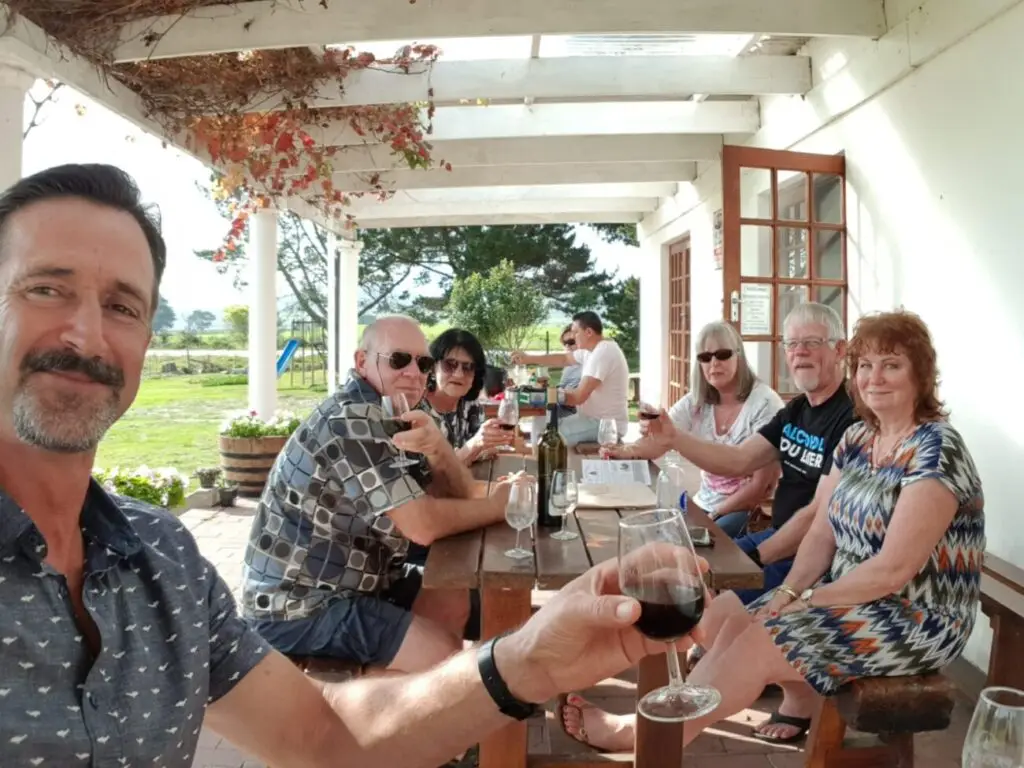 Group enjoying a wine tasting experience in the Cape Winelands